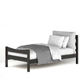 A stylish bed with a black frame and cozy gray sheets, offering a contemporary and comfortable sleeping space.
